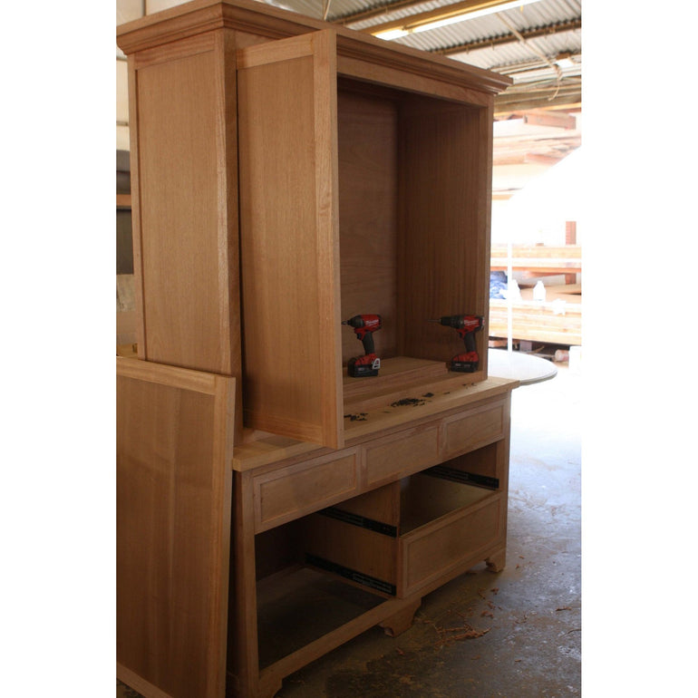 Custom Entertainment Cabinet built in Mahogany wood with pocket doors