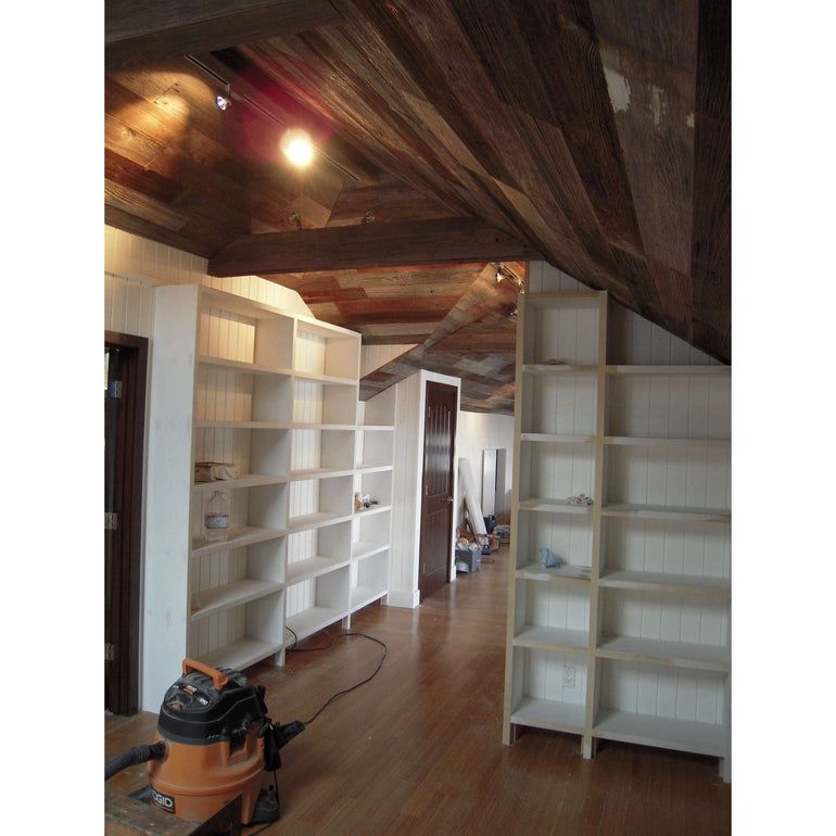 custom built and installed white lacquer bookcases in a luxury home