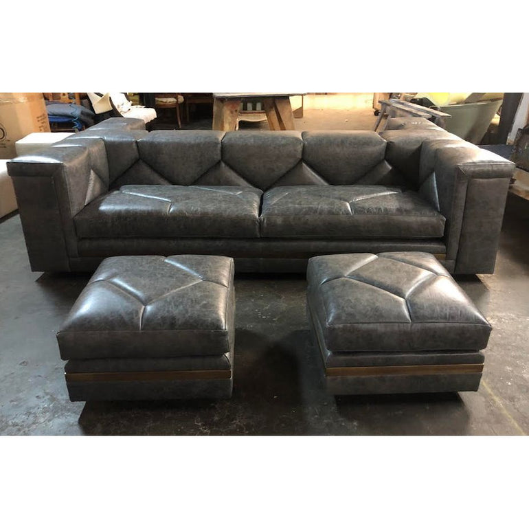 custom diamond tufted sofa with leather and brass ottomans 