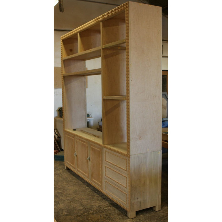 builtin Custom Wall and Home Entertainment Cabinets with decorative moldings 