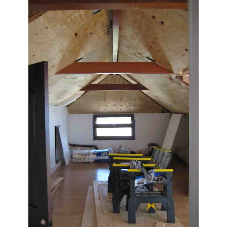 Preparing the ceiling before the installing the old barn wood.