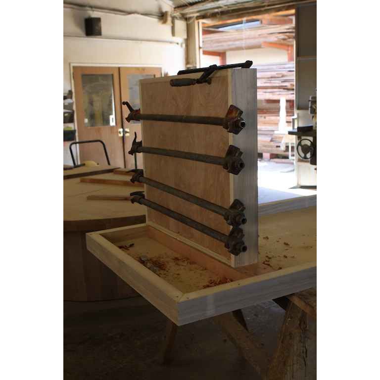 using pipe clamps to glue up the legs