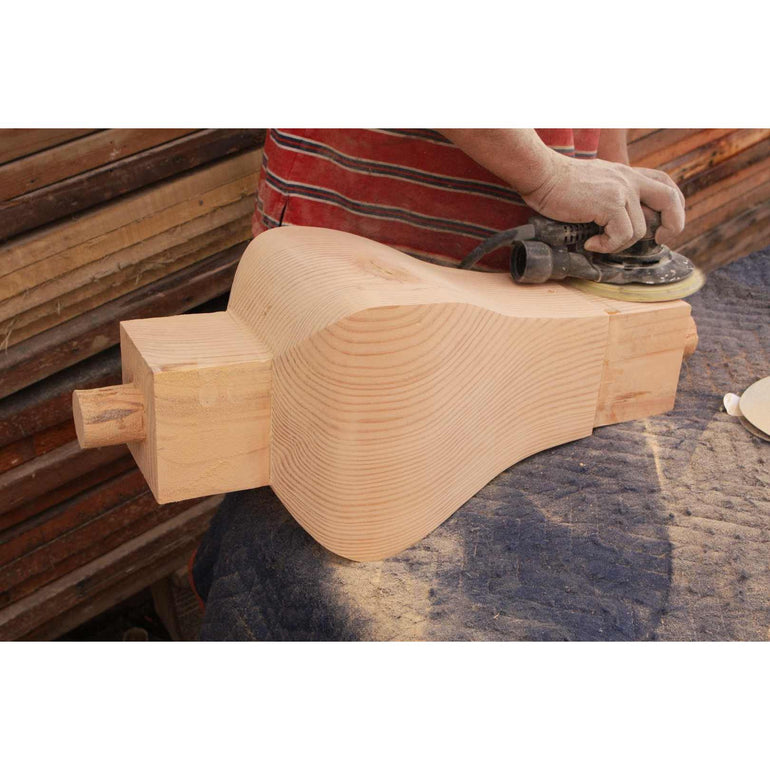 sanding a trestle leg before we assemble